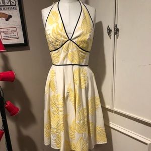 Halter dress with beautiful embroidered fabric .